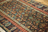 Detailed view of the antique Kuba rug's geometric lattice panels and repeating boteh border.