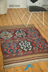 Vintage Shahsavan Kilim rug's lower striped border in natural and muted tones with fringe.