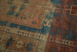 Antique Kazak rug detail: exposed foundation, faded red, blue geometric 