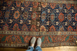 Antique Kurdish runner's allover Mina Khani design in navy, terra cotta, and teal, displaying historic wear.
