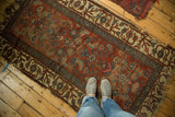 Simplistic Herati design on antique Kurdish Bijar rug in madder red and sky blue, showing authentic wear.