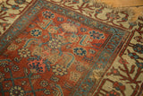 Kurdish Bijar rug detail: madder red Herati pattern, exposed knot heads, heavy tatter.