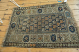 Worn oversized serrated border and tattered fringe of this antique Caucasian rug.