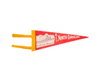 Vintage red felt USS North Carolina pennant with battleship graphic, yellow trim, 4.5x12 inches.