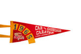 Red felt souvenir pennant with blue 1965 numbers, white text, and antique car graphic.