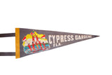 Vintage felt pennant detail with colorful waterskiers, flags, and Cypress Gardens text.