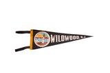 Vintage black felt pennant with colorful lighthouse, sailboats, and 'Wildwood, N.J.' text, 7x20.