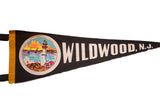 White 'Wildwood, N.J.' lettering on vintage black felt pennant.