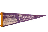 Purple felt pennant with white Benjamin Franklin Memorial building illustration and text.