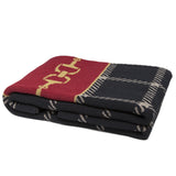 Folded Eco-Friendly Horse Theme Blanket, red with gold horse bits and dark plaid.