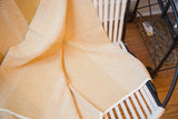 Mustard Eco-Friendly Blanket featuring a detailed herringbone weave texture.