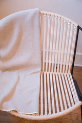 Gray herringbone pattern and soft weave texture of the Eco-Friendly blanket.
