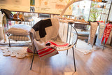 Recycled knit Eco-Friendly throw featuring bold red stripes on gray fabric.