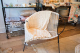 Ivory organic cotton throw, showcasing its classic fisherman cable knit.