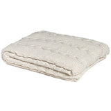Folded Made in USA ivory organic cotton cable knit blanket, 50 x 60 inches.