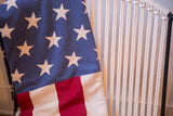 Close-up of the vintage American Flag Throw's knitted texture and starry blue field.