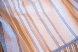 Woven blue herringbone stripe pattern and fringe detail on the eco-friendly blanket.