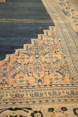 Antique Doroksh carpet's stepped corner with blush floral vines and checkered Lily border motif.