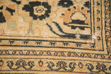 Persian antique Doroksh carpet's worn beige pile, dark motifs, and exposed foundation.