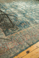 Distressed vintage Mahal rug detail: teal field, faded floral vinery, and muted blush border.
