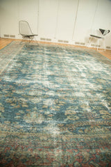 Distressed vintage Mahal carpet pile texture with ocean blue, rose, and intricate floral patterns.