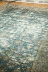 Distressed Persian Mahal carpet featuring faded ocean blue and rose floral vinery with foundation wear.