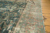 Distressed Mahal carpet with visible foundation, worn texture, and muted floral vinery in blue and red.