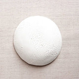 Textured glazed exterior of the handmade white porcelain bowl.