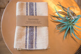 Handwoven Loomination napkin set with cream and navy feedsack stripe pattern.