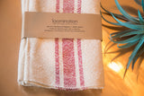 Handwoven Loomination napkin set, cream with wine red stripes and brand band.