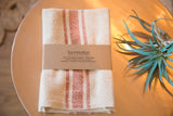 Loomination handwoven sienna orange cream striped cotton napkin set.