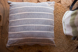 Hand-woven cotton throw pillow in gray with white horizontal stripes, 20x20 inches.