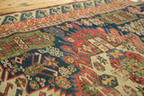 Vintage Seichor rug with rectilinear blossoming flowers, geometric medallions, and a wave border.