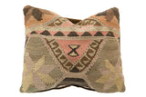 Vintage Kilim Throw Pillow, geometric pattern of browns, pinks, and central hourglass motif.