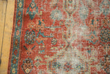 Mostly even wear on the antique Heriz rug, showing exposed foundation and low-pile knot heads.