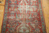 Mostly even wear showing the knot heads and exposed foundation on an antique Persian Heriz runner.