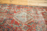 Mostly even wear to knot heads and exposed foundation on this antique Heriz rug runner.