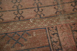 Antique Turkmen rug's faded primitive garden motifs, with areas of exposed foundation.