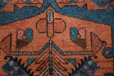Hand-knotted vintage Hamadan rug with stylized brick red and sky blue bird motifs.