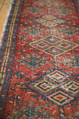 Detail of hand knotted vintage Gorevan runner, cherry red field, geometric guls, and minor border.