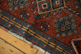 Hard tattered fringe and blue-gold patterned border with geometric guls on vintage Gorevan.