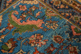 Full wool pile of a collector Engelas rug with moss green and pomegranate red floral motifs.