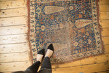 Antique Afshar rug corner shows sky blue field, triple Cyprus trees, even wear, tattered selvage.