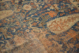 Intricate geometric design of antique Afshar rug, deep blue and terra cotta, with wear to knot heads.