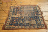 Antique Afshar rug corner, displaying mostly even wear to foundation, tattered selvages, and blue-red pattern.
