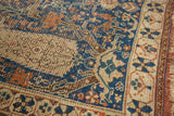 Antique Afshar rug, blue and beige geometric pattern with visible wear and fringed edge.