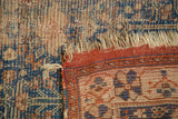Antique Afshar rug's worn foundation, tattered selvage, and madder root red patterned border.