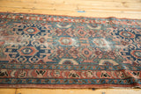 Vintage Lilihan runner, showing dusty rose and indigo geometric-floral field with visible wear.