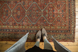 Antique Mission Malayer rug section with geometric scalloped medallions and indigo patterns.
