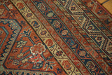 Traditional Malayer motifs of germinating plants in terra cotta, indigo, and sea foam green.